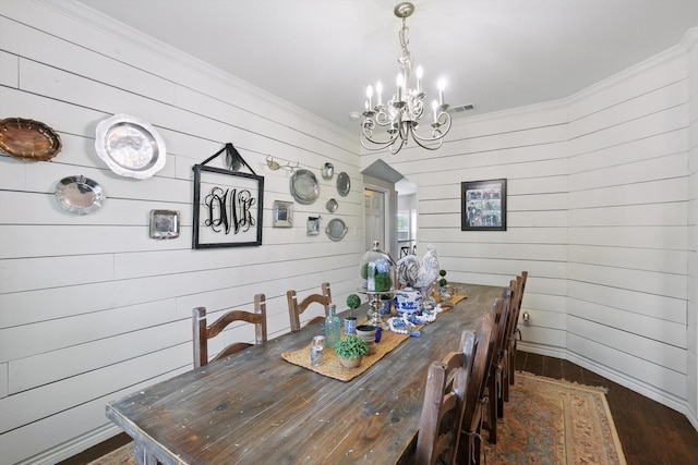 2304 Ranch House Dr, Denton, TX 76210 - dining area featuring wooden walls, a chandelier, ornamental molding, dark wood-style flooring, and baseboards