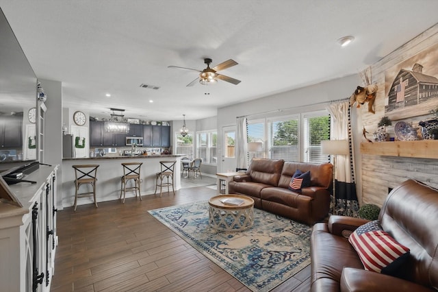 2304 Ranch House Dr, Denton, TX 76210 - living area featuring a ceiling fan, dark wood-style floors, recessed lighting, a chandelier, and baseboards