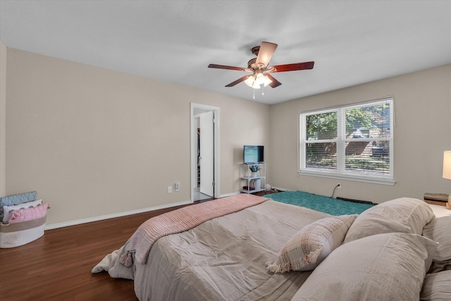 408 Texas Ave, Hewitt, TX 76643 - bedroom featuring wood finished floors, baseboards, and a ceiling fan