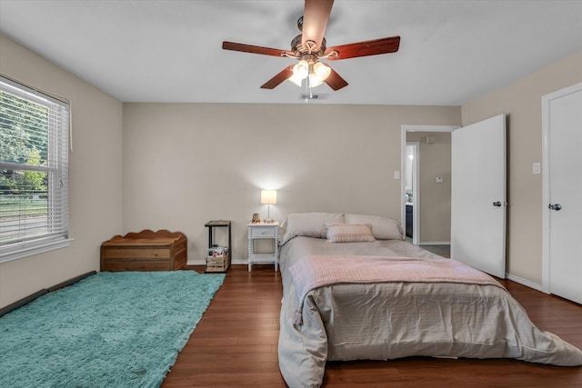 408 Texas Ave, Hewitt, TX 76643 - bedroom with wood finished floors, baseboards, and ceiling fan