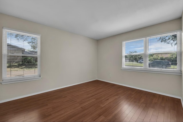 408 Texas Ave, Hewitt, TX 76643 - spare room with healthy amount of natural light, wood finished floors, and baseboards