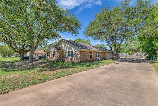 408 Texas Ave, Hewitt, TX 76643 - view of side of home featuring brick siding and driveway