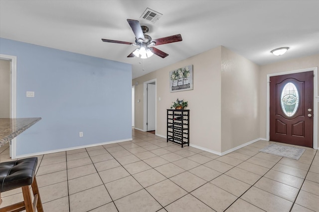 408 Texas Ave, Hewitt, TX 76643 - foyer featuring ceiling fan, light tile patterned floors, and baseboards