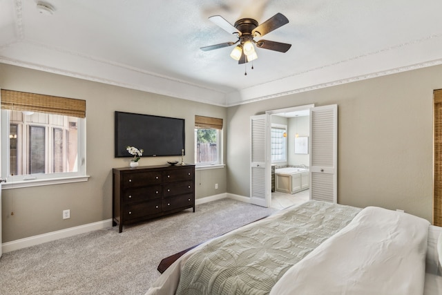 4406 Cobblers Ln, Dallas, TX 75287 - carpeted bedroom with baseboards, ensuite bathroom, and a ceiling fan
