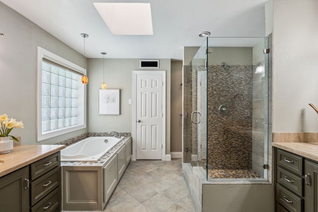 4406 Cobblers Ln, Dallas, TX 75287 - bathroom with a skylight, a bath, vanity, a stall shower, and baseboards