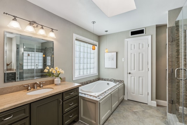 4406 Cobblers Ln, Dallas, TX 75287 - full bathroom featuring vanity, a shower stall, a bath, and a skylight