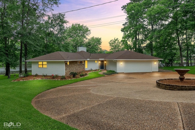 1863 Glen Cove Dr, Benton, LA 71006 - ranch-style house with curved driveway, a chimney, a yard, and an attached garage