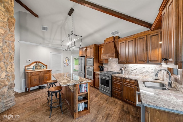 1863 Glen Cove Dr, Benton, LA 71006 - kitchen with appliances with stainless steel finishes, a sink, premium range hood, beamed ceiling, and a kitchen breakfast bar