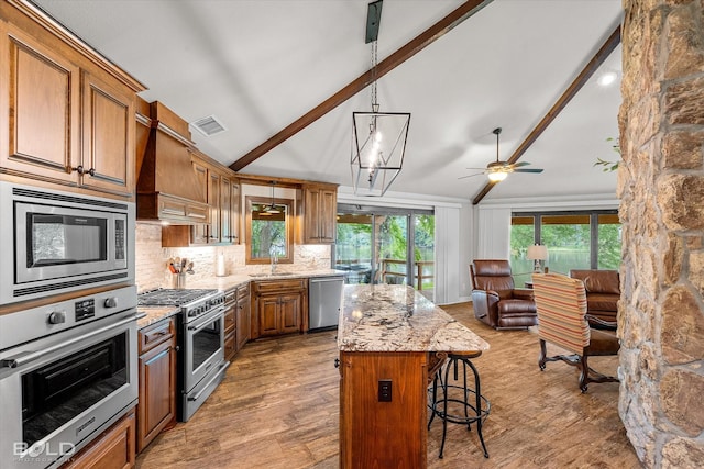 1863 Glen Cove Dr, Benton, LA 71006 - kitchen with stainless steel appliances, custom exhaust hood, beamed ceiling, a sink, and ceiling fan