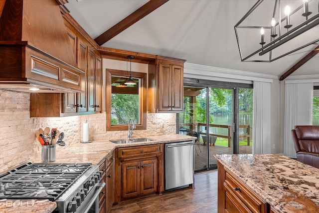 1863 Glen Cove Dr, Benton, LA 71006 - kitchen with appliances with stainless steel finishes, a sink, light stone counters, brown cabinets, and crown molding