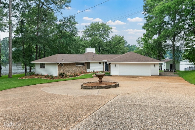1863 Glen Cove Dr, Benton, LA 71006 - single story home with a chimney, a garage, driveway, stone siding, and a front lawn