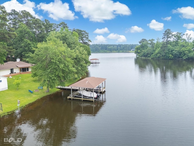 1863 Glen Cove Dr, Benton, LA 71006 - dock area featuring boat lift, a water view, a view of trees, and a yard