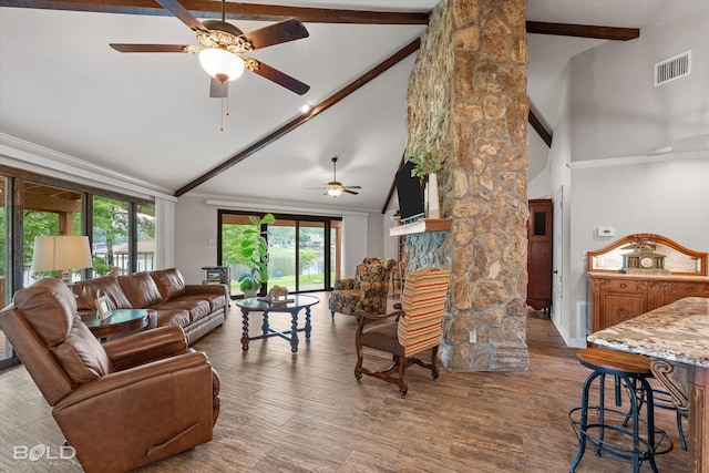 1863 Glen Cove Dr, Benton, LA 71006 - living room with ceiling fan, high vaulted ceiling, beamed ceiling, a fireplace, and wood finished floors