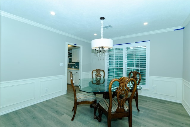 3824 Wagonwheel Ct, Plano, TX 75023 - dining room with a chandelier, wainscoting, light wood-style flooring, recessed lighting, and a decorative wall