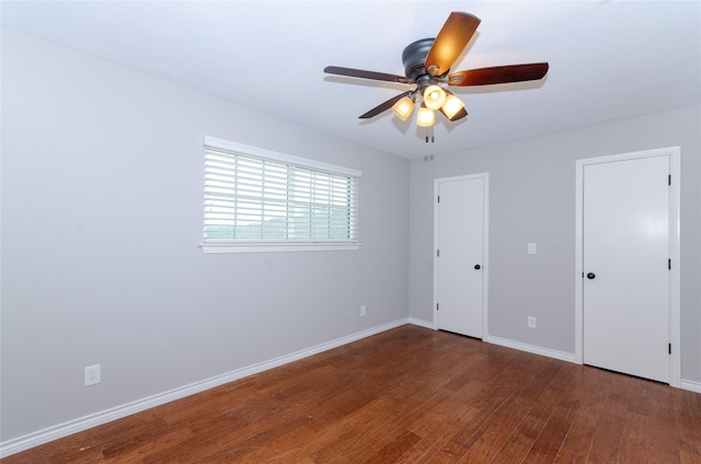 3824 Wagonwheel Ct, Plano, TX 75023 - unfurnished bedroom featuring wood finished floors, baseboards, and a ceiling fan