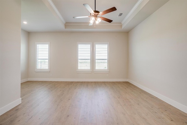 6145 Lucia Dr, Fort Worth, TX 76123 - empty room with crown molding, a tray ceiling, light wood-style flooring, ceiling fan, and baseboards