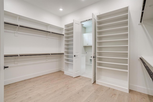 6145 Lucia Dr, Fort Worth, TX 76123 - walk in closet featuring light wood-type flooring