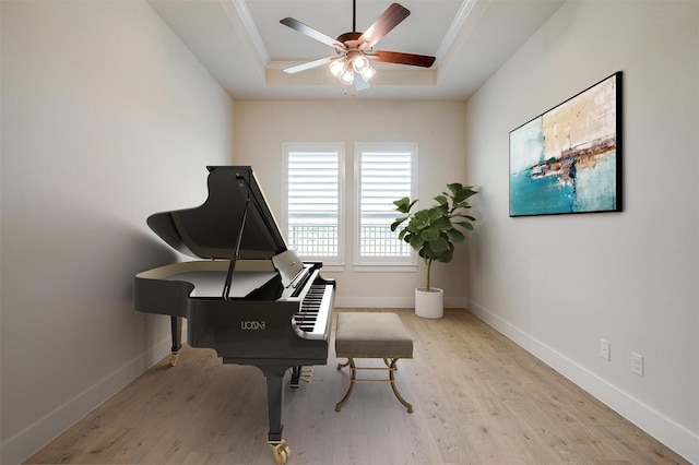 6145 Lucia Dr, Fort Worth, TX 76123 - living area with a tray ceiling, wood finished floors, a ceiling fan, and baseboards