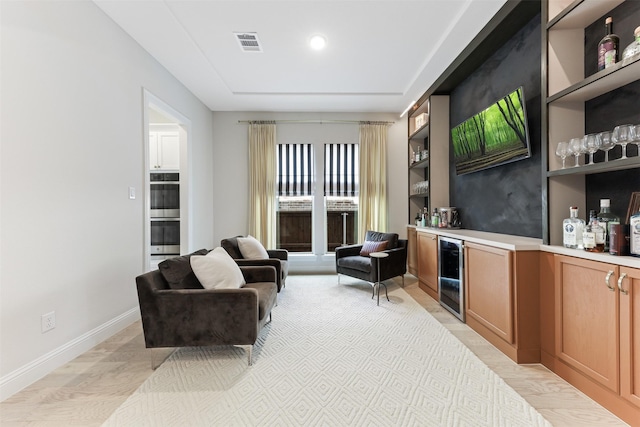 2880 Meadow Dell Dr, Prosper, TX 75078 - living area featuring wine cooler, a bar, and baseboards