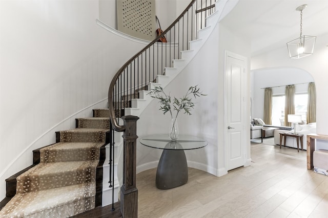 2880 Meadow Dell Dr, Prosper, TX 75078 - staircase featuring a high ceiling, baseboards, and wood finished floors