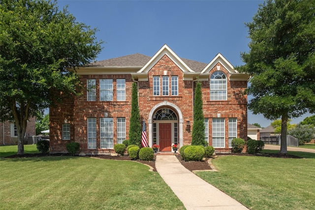 1312 Camberley Ct, Keller, TX 76248 - view of front of house with a front yard, brick siding, and roof with shingles