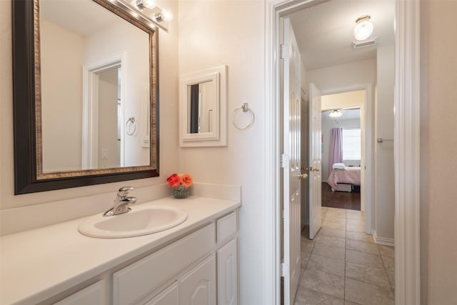 1312 Camberley Ct, Keller, TX 76248 - bathroom featuring vanity, tile patterned floors, and ensuite bathroom