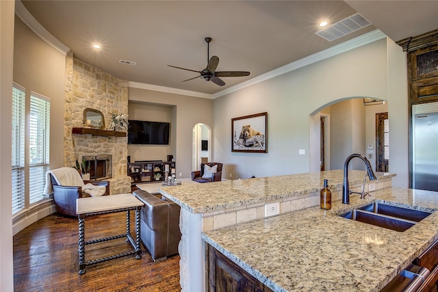 552 Horseshoe Bnd, Royse City, TX 75189 - kitchen featuring a sink, arched walkways, high end refrigerator, ceiling fan, and dark wood-style flooring