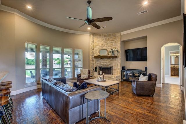552 Horseshoe Bnd, Royse City, TX 75189 - living area with a ceiling fan, arched walkways, ornamental molding, a fireplace, and baseboards