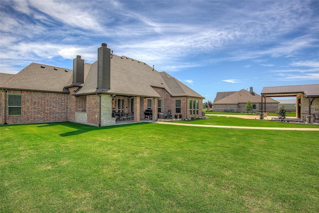 552 Horseshoe Bnd, Royse City, TX 75189 - rear view of property with a patio area, a lawn, a chimney, a shingled roof, and a gazebo
