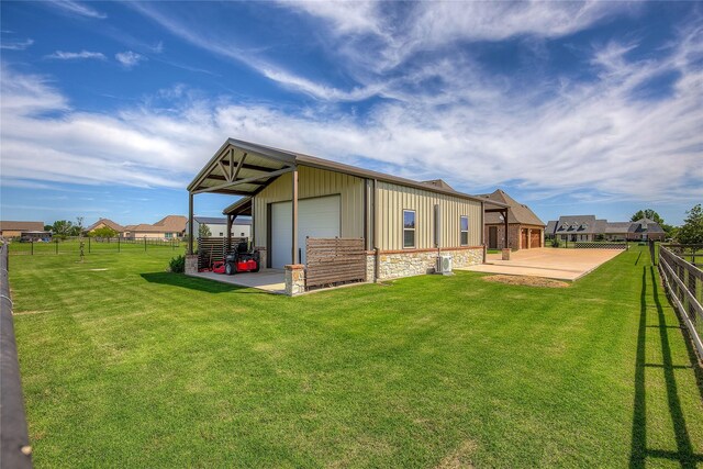 552 Horseshoe Bnd, Royse City, TX 75189 - rear view of property with stone siding, a garage, and an outdoor structure