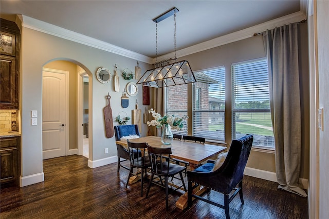 552 Horseshoe Bnd, Royse City, TX 75189 - dining space with arched walkways, ornamental molding, healthy amount of natural light, baseboards, and dark wood finished floors