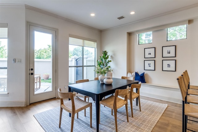 7904 Fair Oaks Ave, Dallas, TX 75231 - dining area with healthy amount of natural light, ornamental molding, light wood-type flooring, recessed lighting, and baseboards