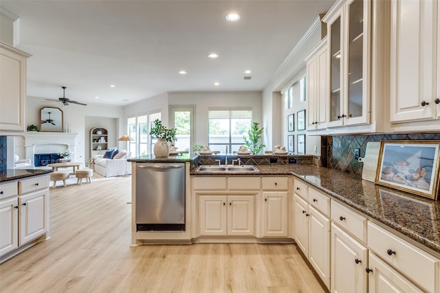 7904 Fair Oaks Ave, Dallas, TX 75231 - kitchen with dishwasher, a sink, a fireplace, light wood-style floors, and recessed lighting
