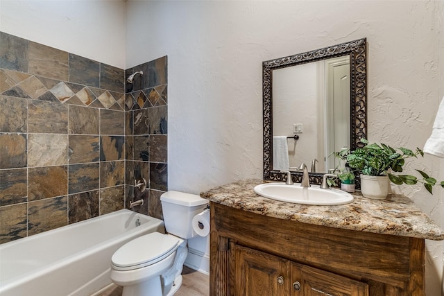 7904 Fair Oaks Ave, Dallas, TX 75231 - bathroom featuring vanity, toilet, washtub / shower combination, and a textured wall