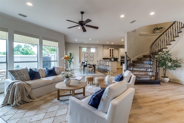 7904 Fair Oaks Ave, Dallas, TX 75231 - living room featuring recessed lighting, ceiling fan, light wood-style flooring, stairway, and baseboards