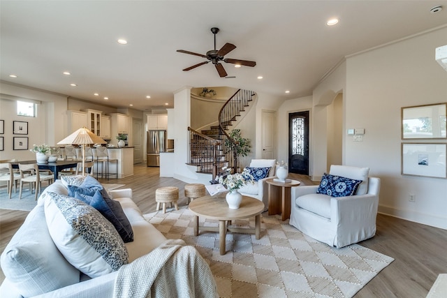 7904 Fair Oaks Ave, Dallas, TX 75231 - living area with light wood-style flooring, stairs, recessed lighting, a ceiling fan, and ornamental molding