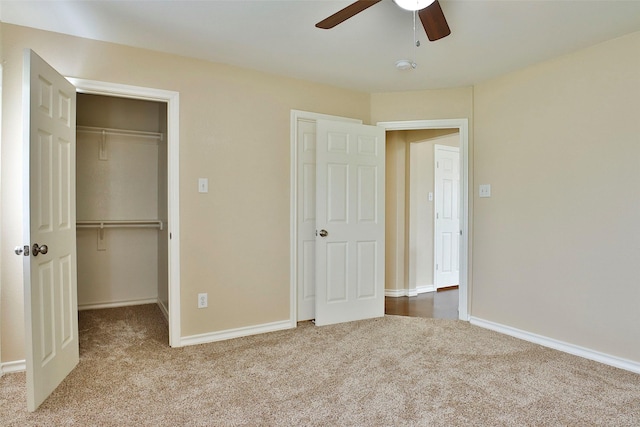 7703 Stanley, Joshua, TX 76058 - unfurnished bedroom with carpet, a closet, baseboards, and a walk in closet