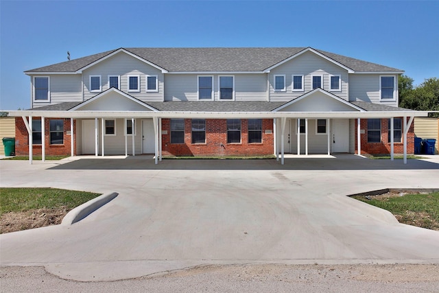 7703 Stanley, Joshua, TX 76058 - view of property with covered porch, brick siding, concrete driveway, and a shingled roof