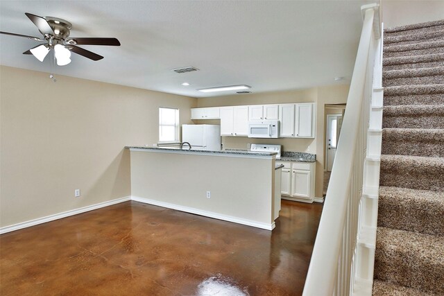 7703 Stanley, Joshua, TX 76058 - kitchen featuring white appliances, concrete floors, baseboards, ceiling fan, and recessed lighting