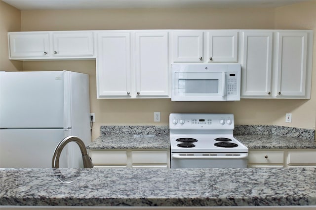 7703 Stanley, Joshua, TX 76058 - kitchen featuring white appliances, white cabinets, and light stone countertops