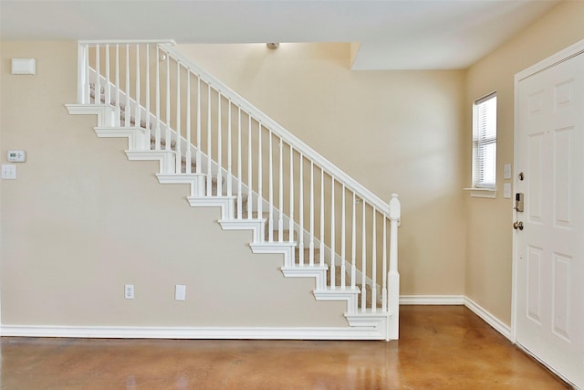 7703 Stanley, Joshua, TX 76058 - foyer featuring concrete floors, stairs, and baseboards