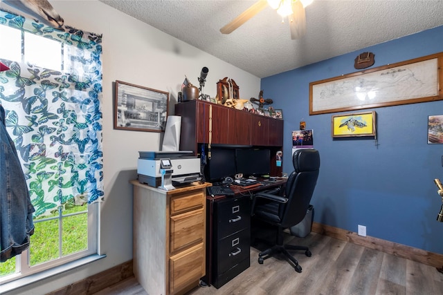 250 Whispering Oaks, Payne Springs, TX 75156 - office with light wood-style floors, a textured ceiling, a ceiling fan, and baseboards
