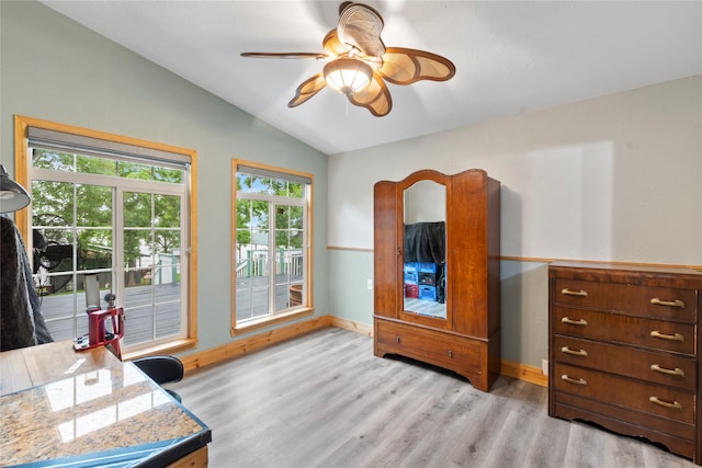 250 Whispering Oaks, Payne Springs, TX 75156 - home office featuring lofted ceiling, light wood-type flooring, a ceiling fan, and baseboards