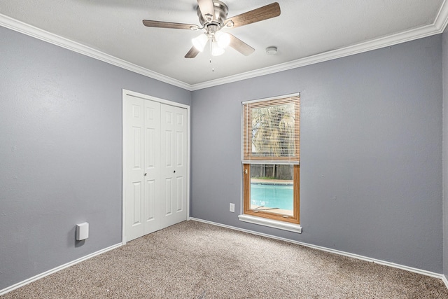 7107 Greenspring Dr, Arlington, TX 76016 - unfurnished bedroom featuring carpet, crown molding, a closet, baseboards, and ceiling fan