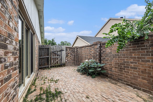 7107 Greenspring Dr, Arlington, TX 76016 - view of patio / terrace featuring a gate