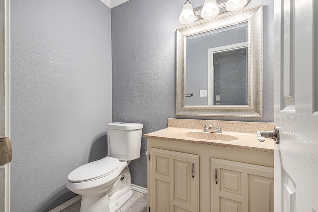 7107 Greenspring Dr, Arlington, TX 76016 - bathroom with vanity, toilet, baseboards, and a textured wall