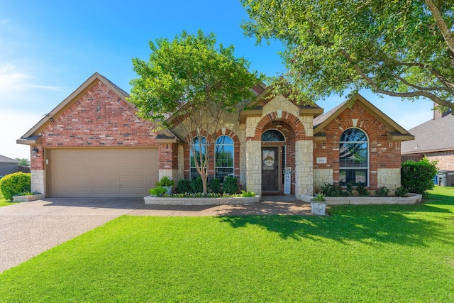 306 Hardeman Blvd, Justin, TX 76247 - traditional-style house featuring brick siding, a garage, a front lawn, and driveway