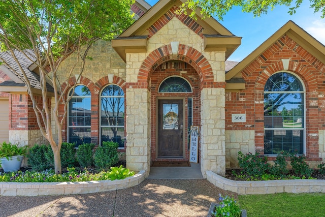 306 Hardeman Blvd, Justin, TX 76247 - property entrance featuring stone siding and brick siding