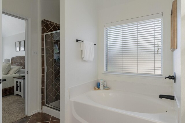 306 Hardeman Blvd, Justin, TX 76247 - bathroom featuring a garden tub, a stall shower, and tile patterned flooring