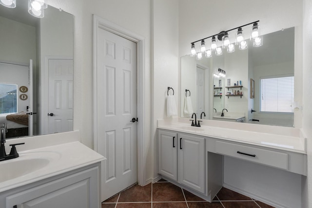 306 Hardeman Blvd, Justin, TX 76247 - bathroom with vanity and tile patterned flooring